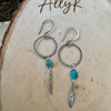 Elegant Royston Turquoise Sterling Silver Circle Earrings with Feather Accents