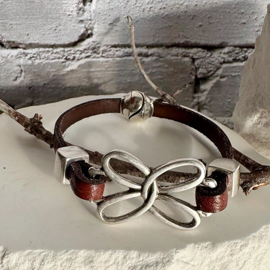 Embossed leather bracelet with stainless steel twisted butterfly connector, dark brown or black