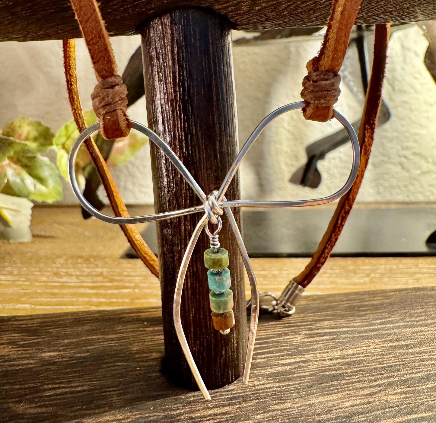 Sterling silver handmade bow on genuine deerskin single leather lace with turquoise dangle
