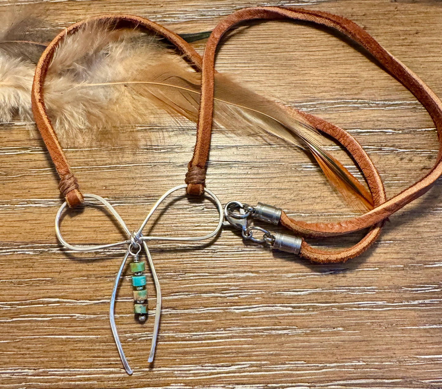 Sterling silver handmade bow on genuine deerskin single leather lace with turquoise dangle