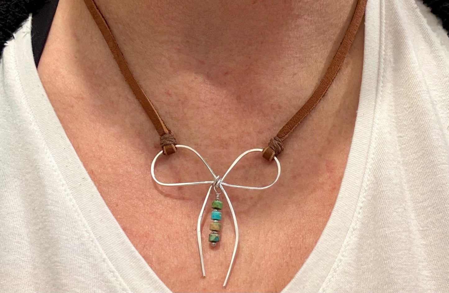Sterling silver handmade bow on genuine deerskin single leather lace with turquoise dangle