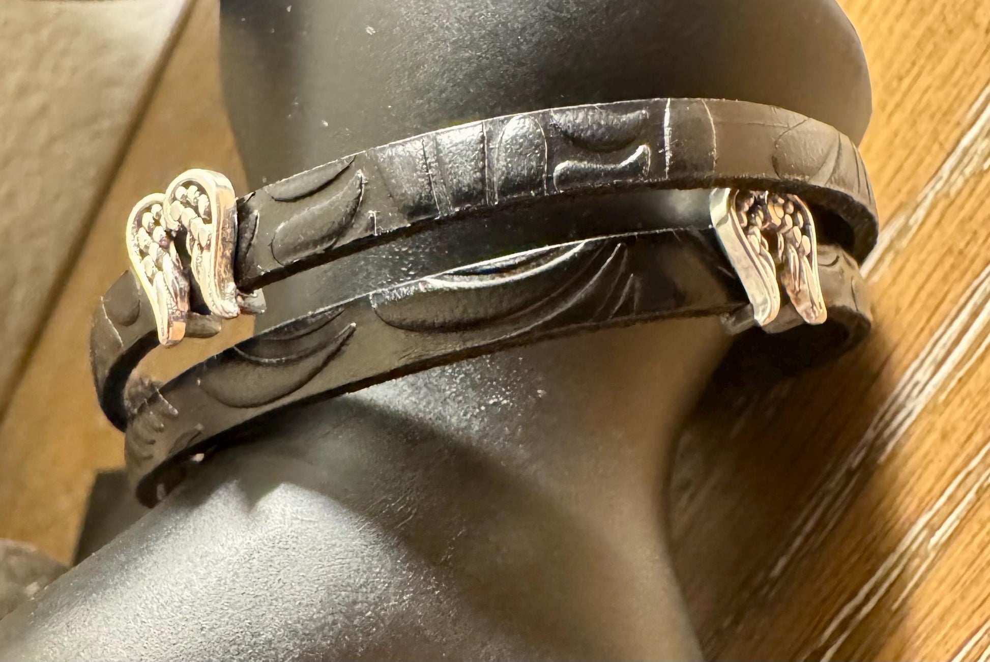 Embossed flower pattern leather wrap bracelet with angel wings spacers and magnet closure, black or dark brown leather
