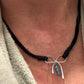Dainty little silver handmade bow on genuine deerskin single leather lace with turquoise dangle