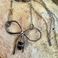 Sterling silver oxidized small bow necklace with black onyx and sterling flower spacers
