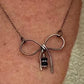 Sterling silver oxidized small bow necklace with black onyx and sterling flower spacers