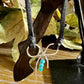 Dainty little silver handmade bow on genuine deerskin single leather lace with turquoise dangle