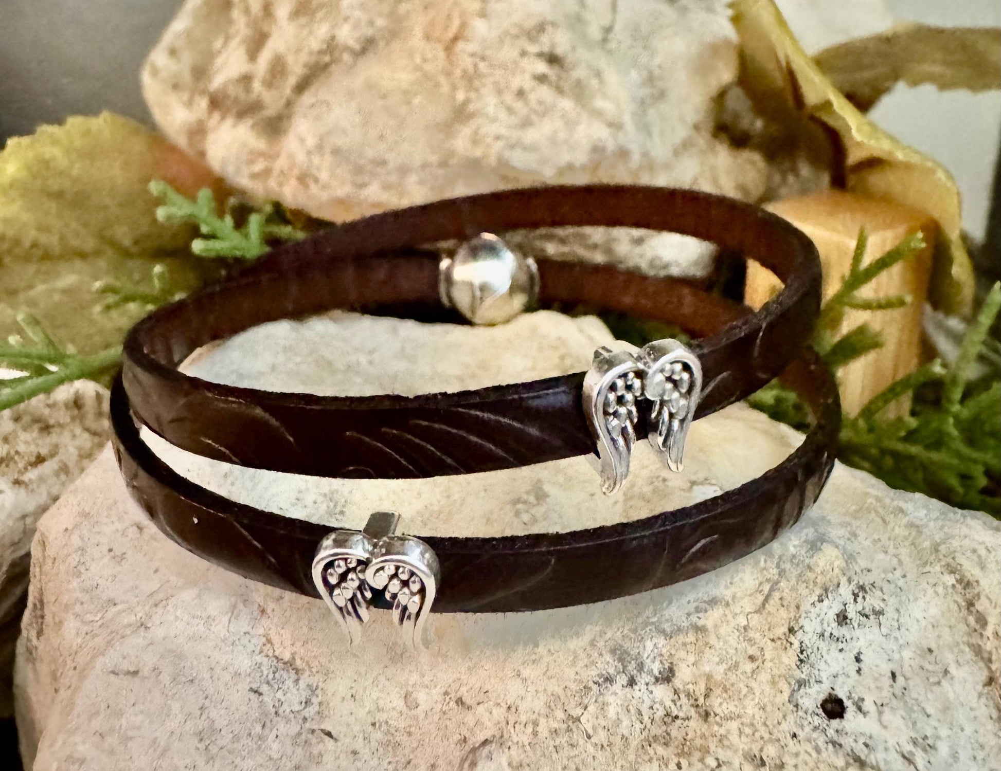 Embossed flower pattern leather wrap bracelet with angel wings spacers and magnet closure, black or dark brown leather