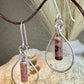 Black pink rhodonite gemstone with sterling silver teardrop style dangle