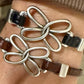Embossed leather bracelet with stainless steel twisted butterfly connector, dark brown or black