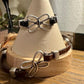 Embossed leather bracelet with stainless steel twisted butterfly connector, dark brown or black
