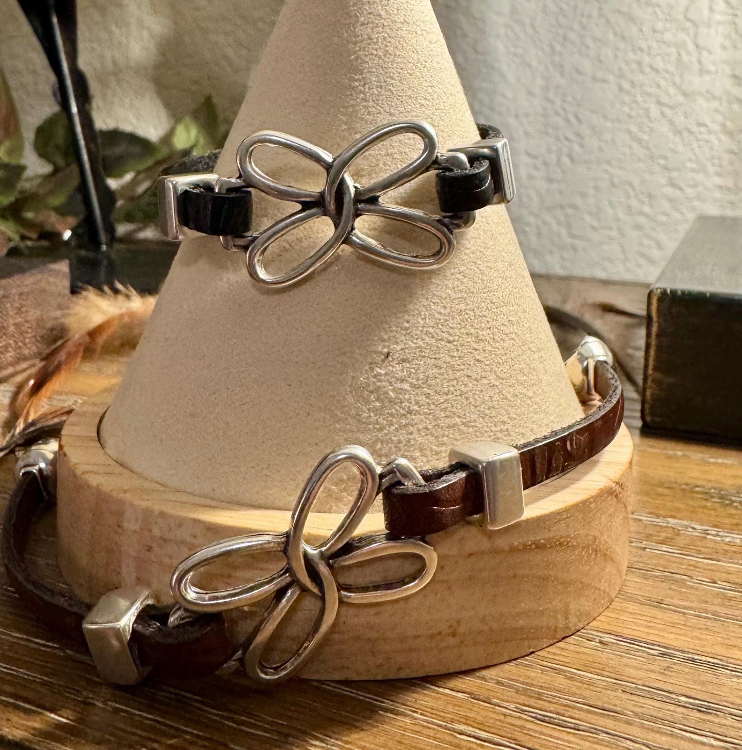 Embossed leather bracelet with stainless steel twisted butterfly connector, dark brown or black