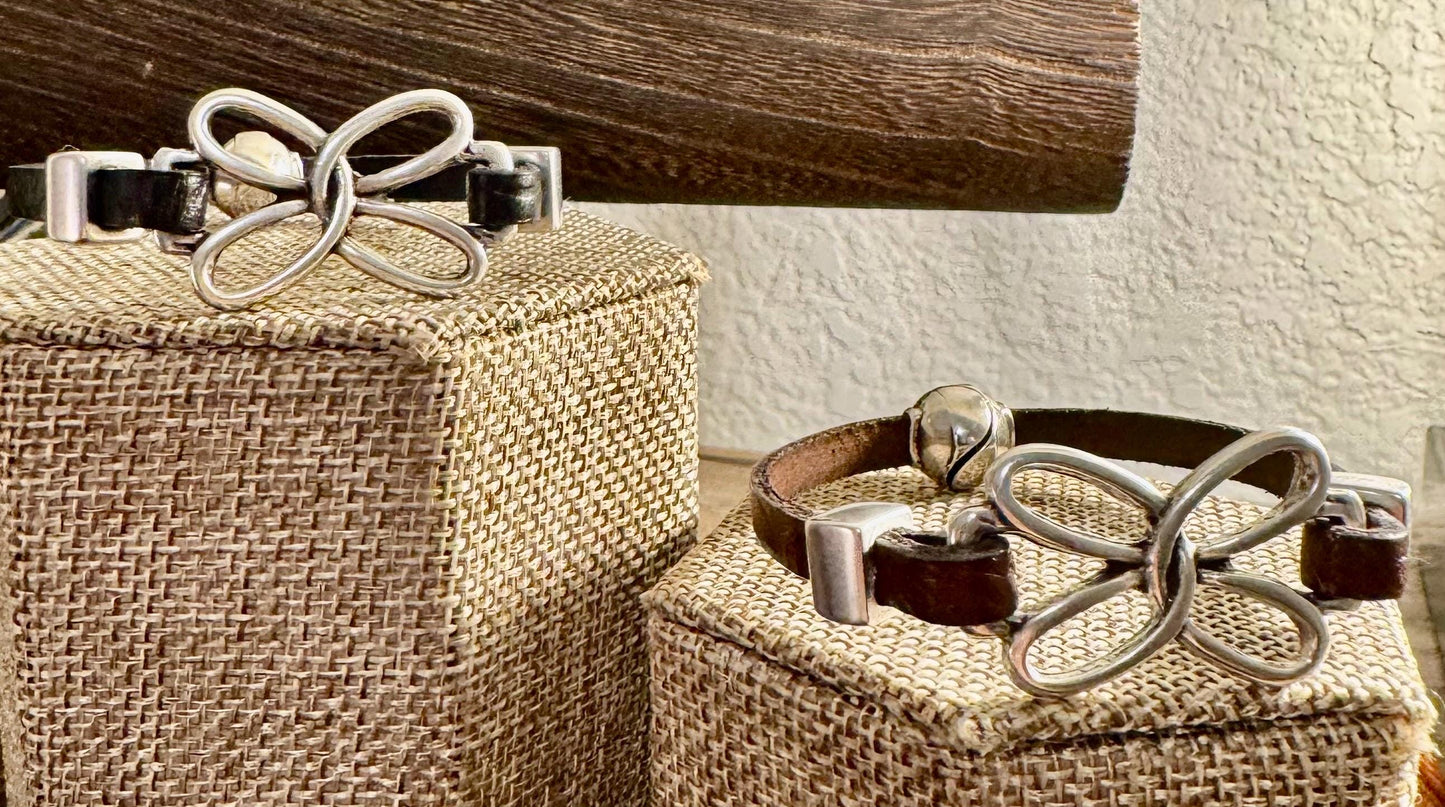 Embossed leather bracelet with stainless steel twisted butterfly connector, dark brown or black