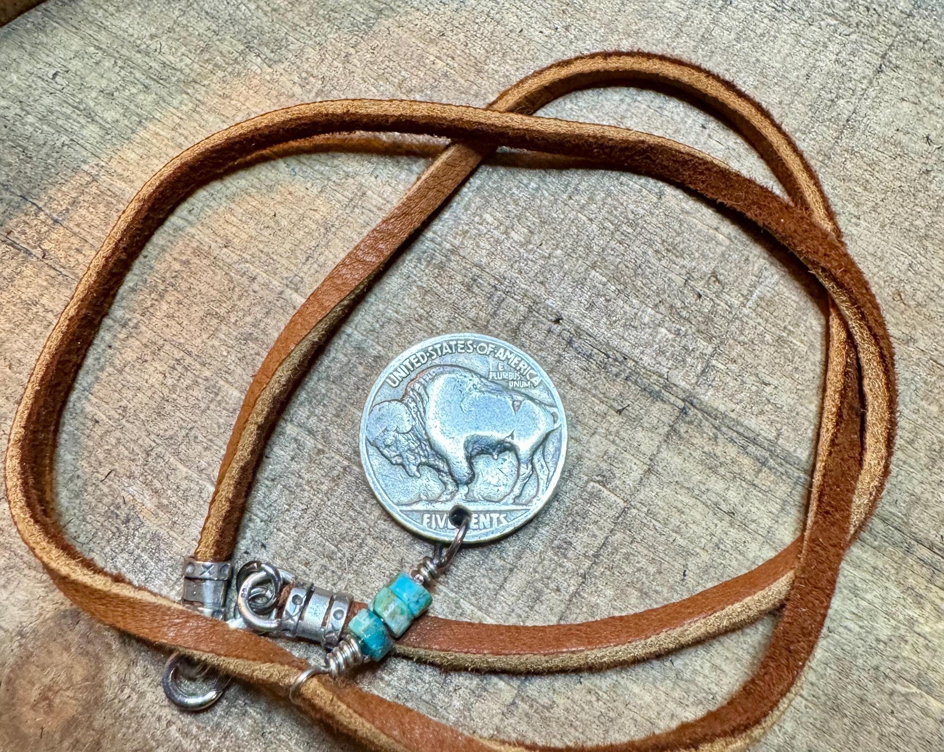 Indian head buffalo nickel on genuine deerskin single leather lace with turquoise gemstone