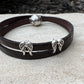 Embossed flower pattern leather wrap bracelet with angel wings spacers and magnet closure, black or dark brown leather