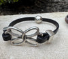 Embossed leather bracelet with stainless steel twisted butterfly connector, dark brown or black