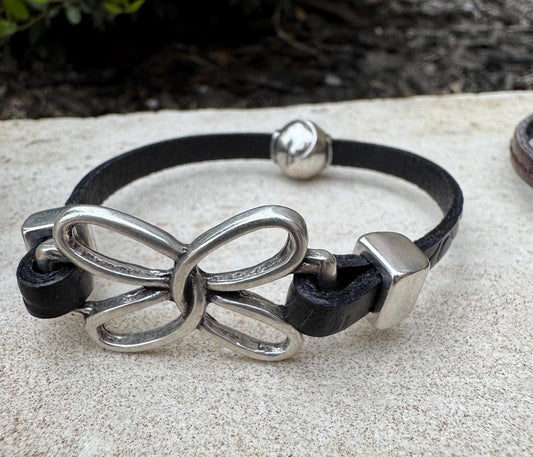 Embossed leather bracelet with stainless steel twisted butterfly connector, dark brown or black