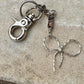 Keychain with black pink rhodonite gemstones and sterling silver bow