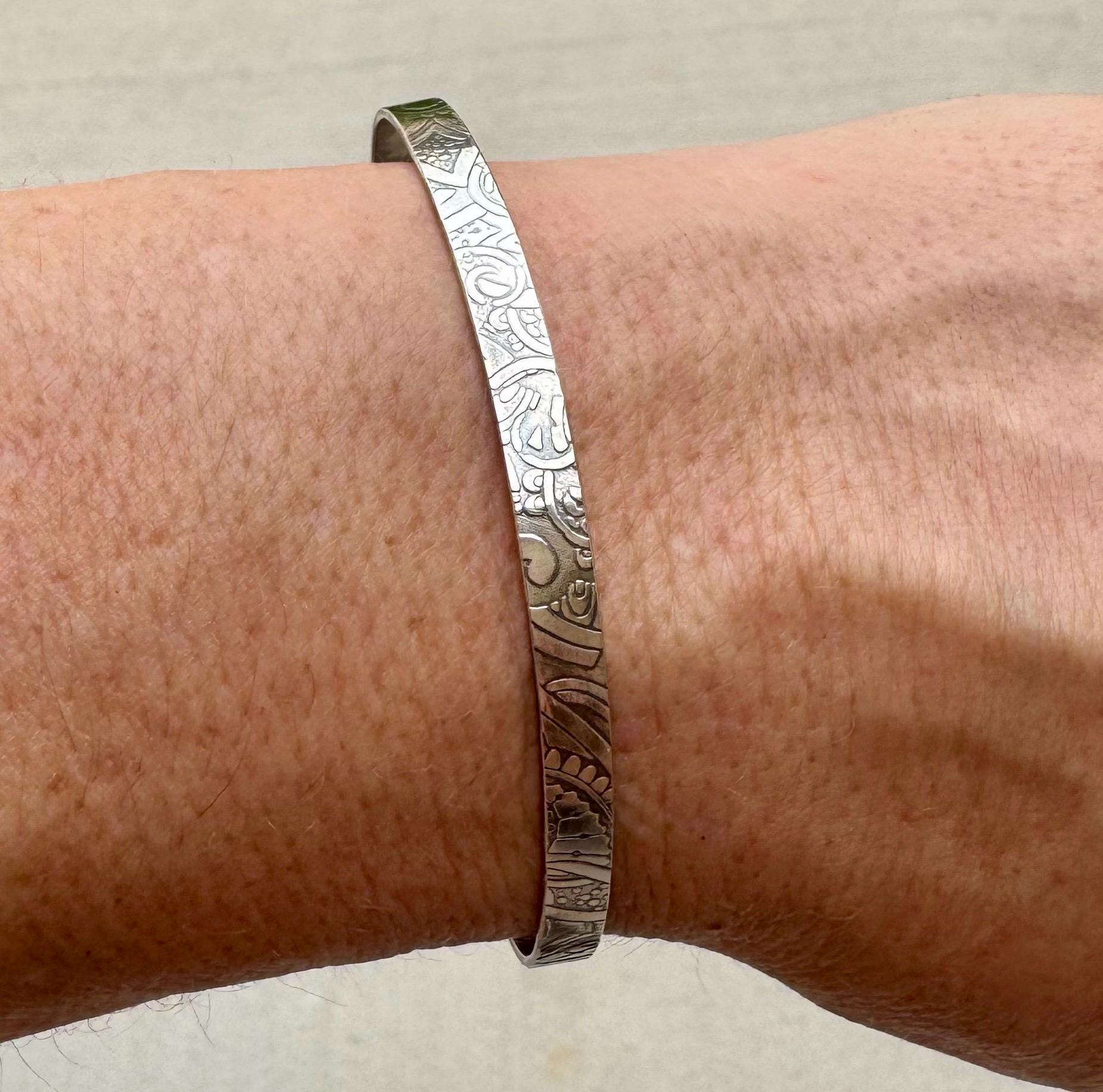 Flower doodle imprinted sterling silver cuff bracelet
