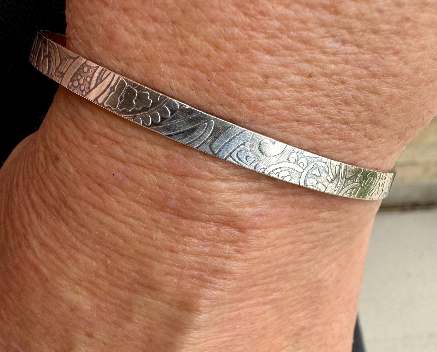 Flower doodle imprinted sterling silver cuff bracelet