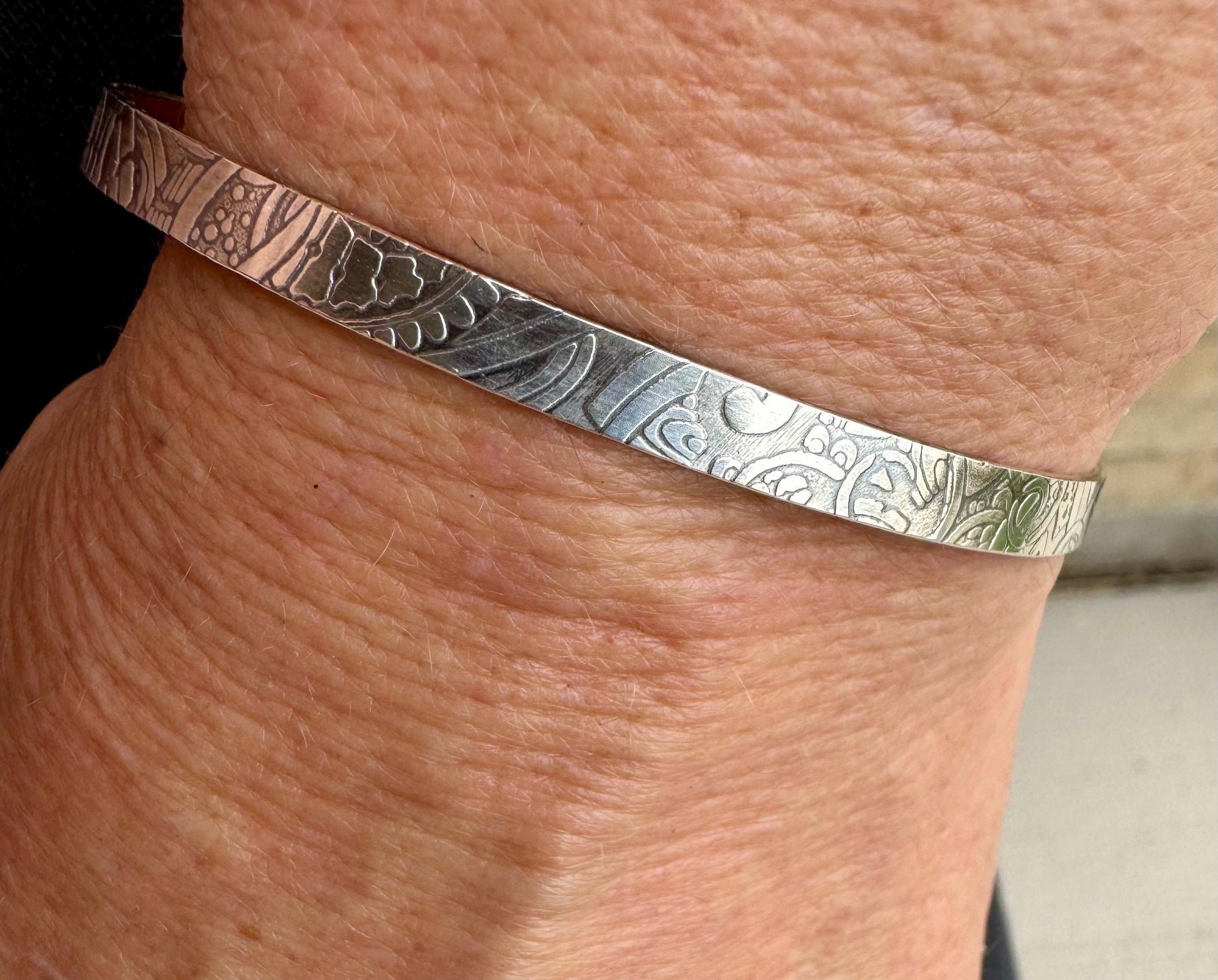 Flower doodle imprinted sterling silver cuff bracelet