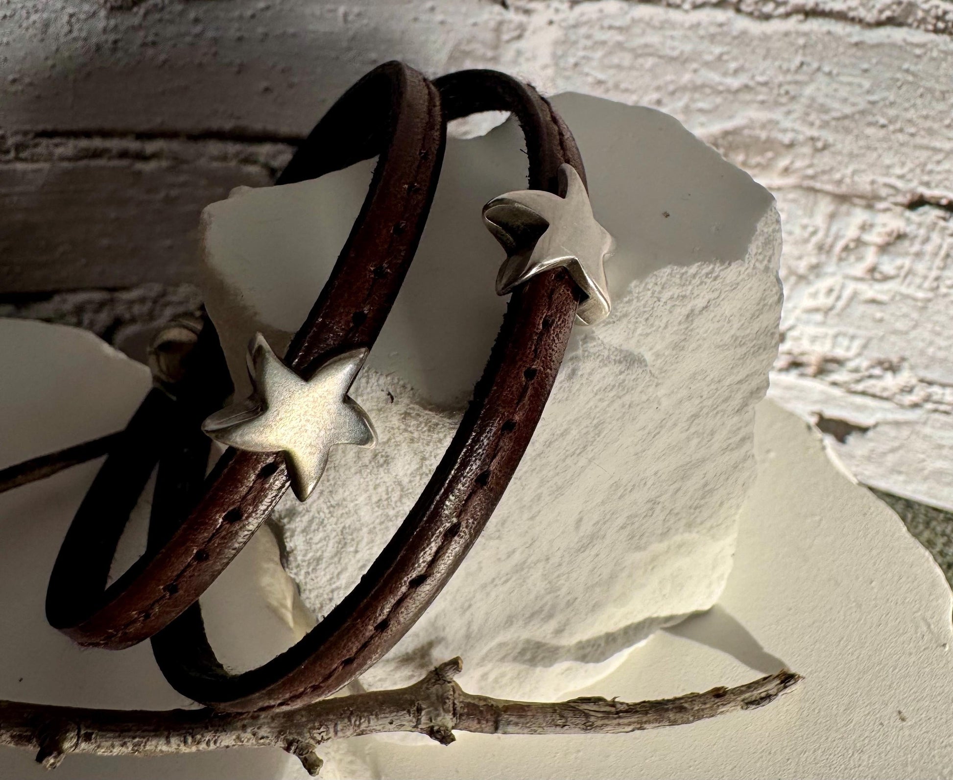 Leather wrap bracelet with silver star sliders and magnet closure