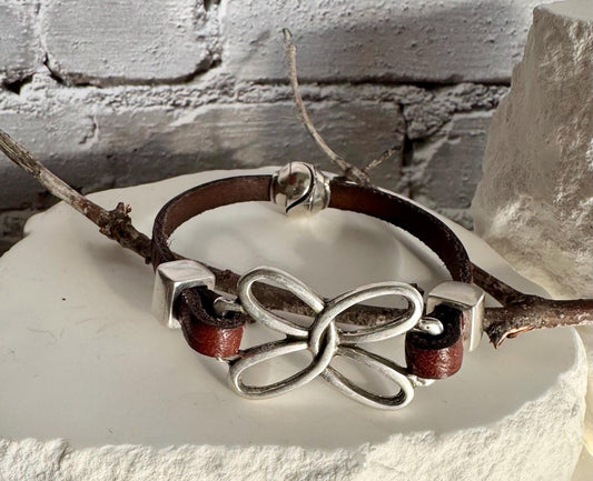 Embossed leather bracelet with stainless steel twisted butterfly connector, dark brown or black