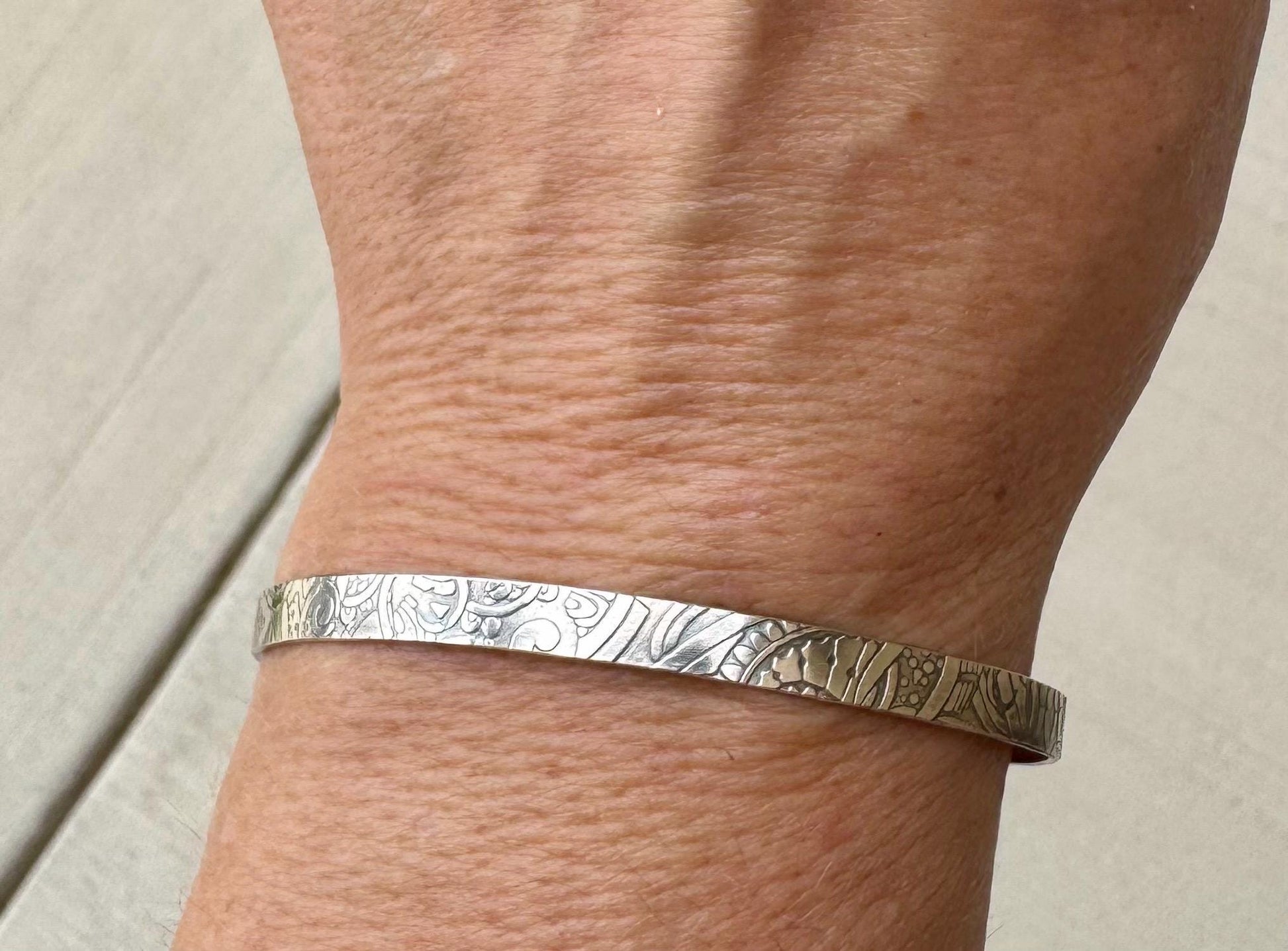 Flower doodle imprinted sterling silver cuff bracelet