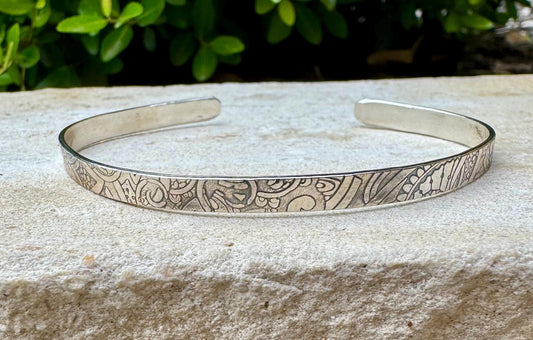 Flower doodle imprinted sterling silver cuff bracelet