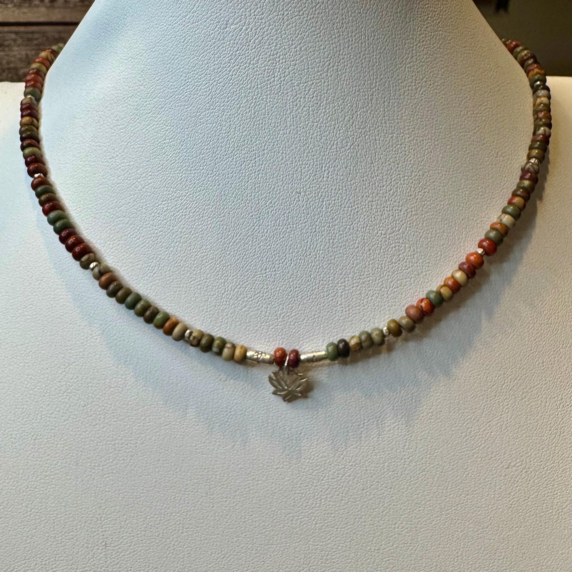Picasso Red Creek Jasper gemstone necklace with sterling silver spacers and lotus flower pendant