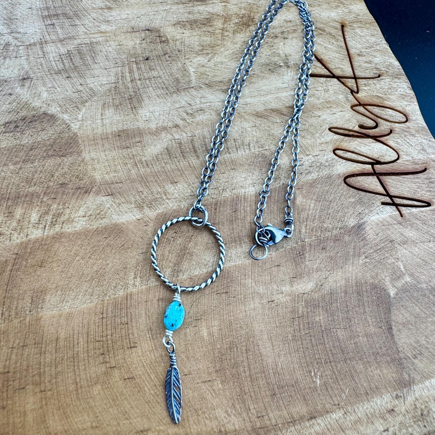 Royston Turquoise Sterling Silver Necklace: Circle Pendant with Feather Accent