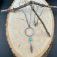 Royston Turquoise Sterling Silver Necklace: Circle Pendant with Feather Accent