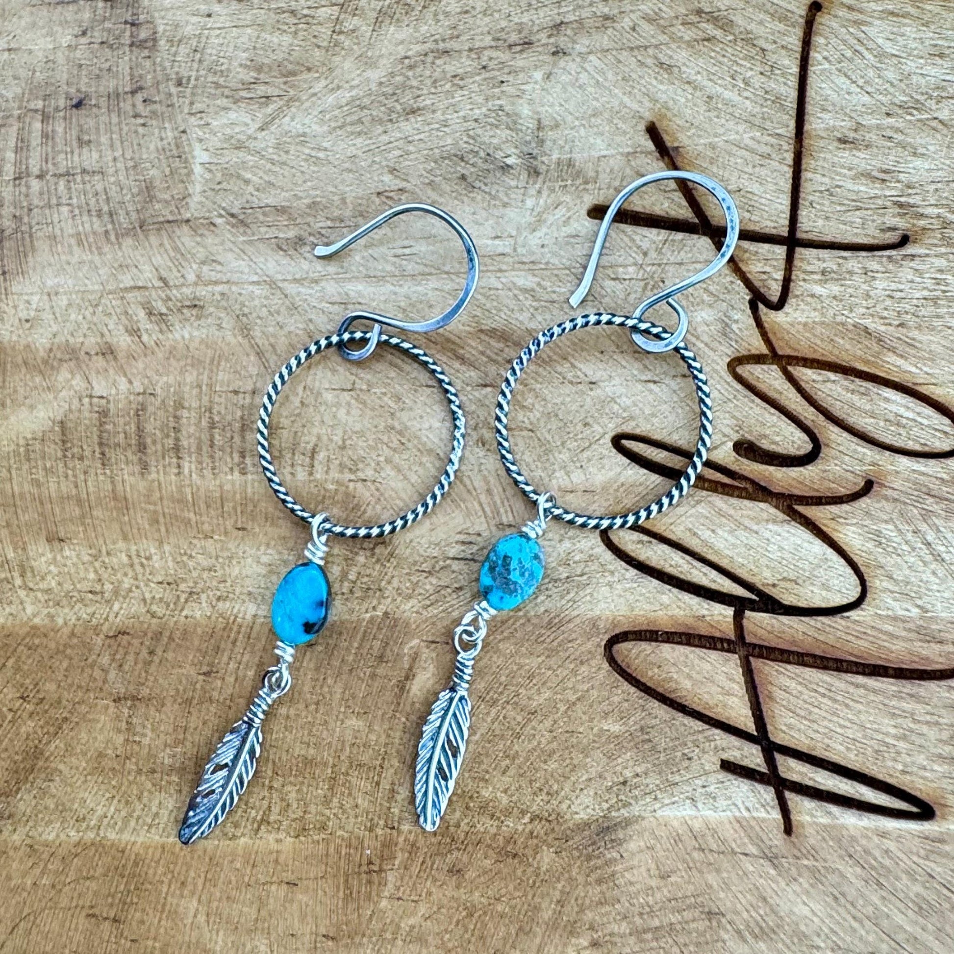 Elegant Royston Turquoise Sterling Silver Circle Earrings with Feather Accents