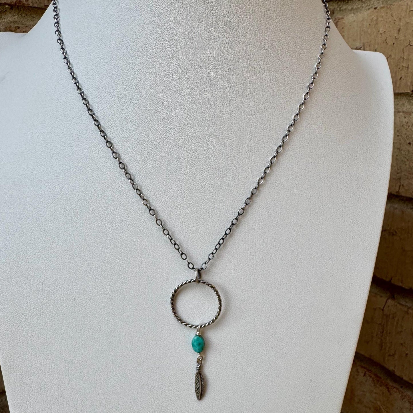 Royston Turquoise Sterling Silver Necklace: Circle Pendant with Feather Accent
