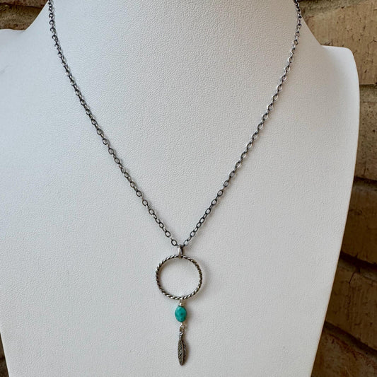 Royston Turquoise Sterling Silver Necklace: Circle Pendant with Feather Accent