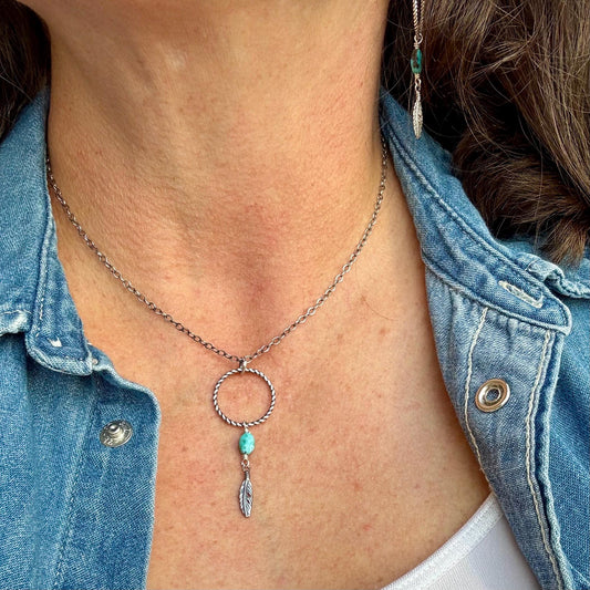 Royston Turquoise Sterling Silver Necklace: Circle Pendant with Feather Accent