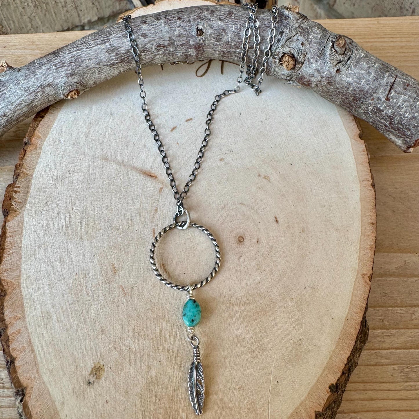 Royston Turquoise Sterling Silver Necklace: Circle Pendant with Feather Accent