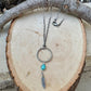 Royston Turquoise Sterling Silver Necklace: Circle Pendant with Feather Accent