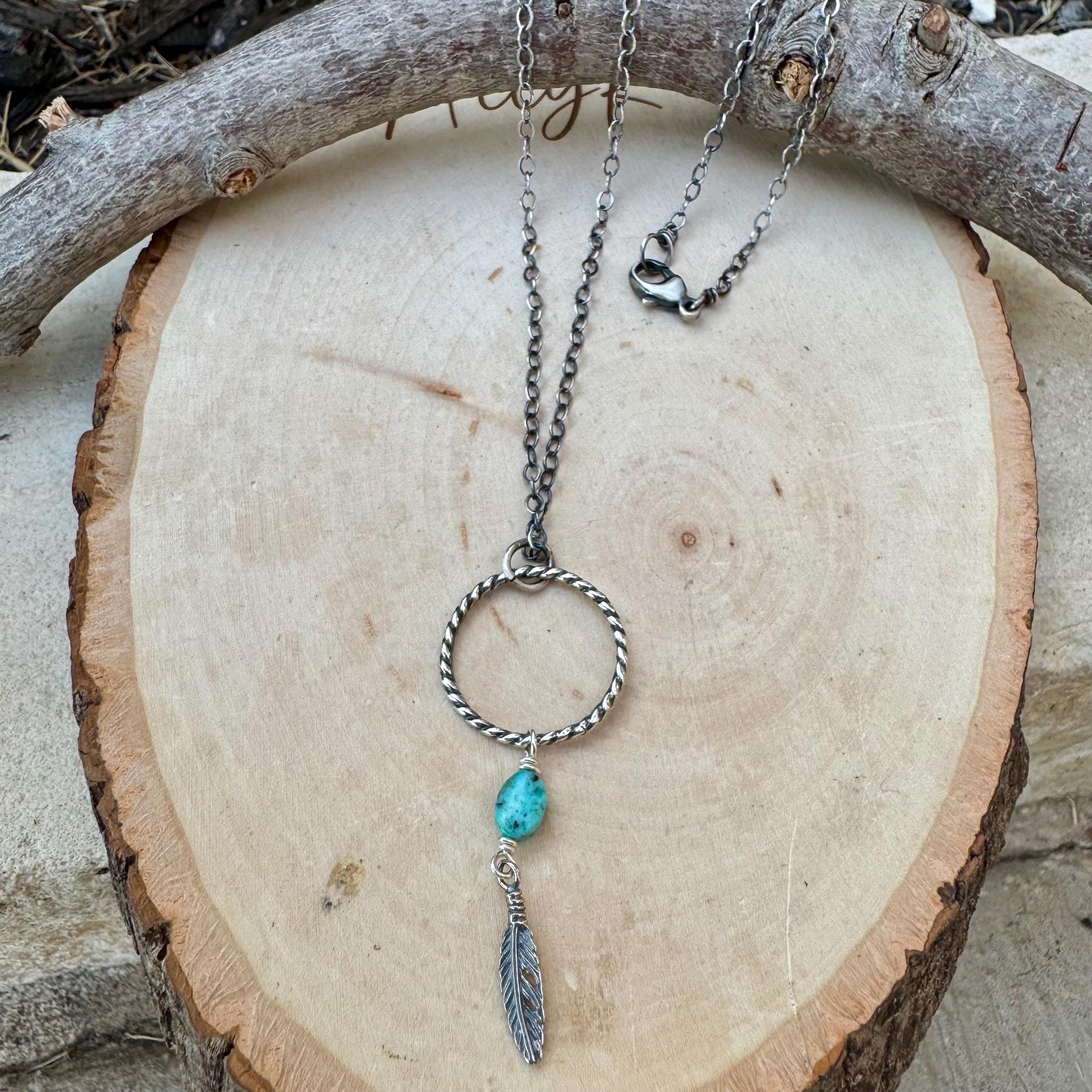 Royston Turquoise Sterling Silver Necklace: Circle Pendant with Feather Accent