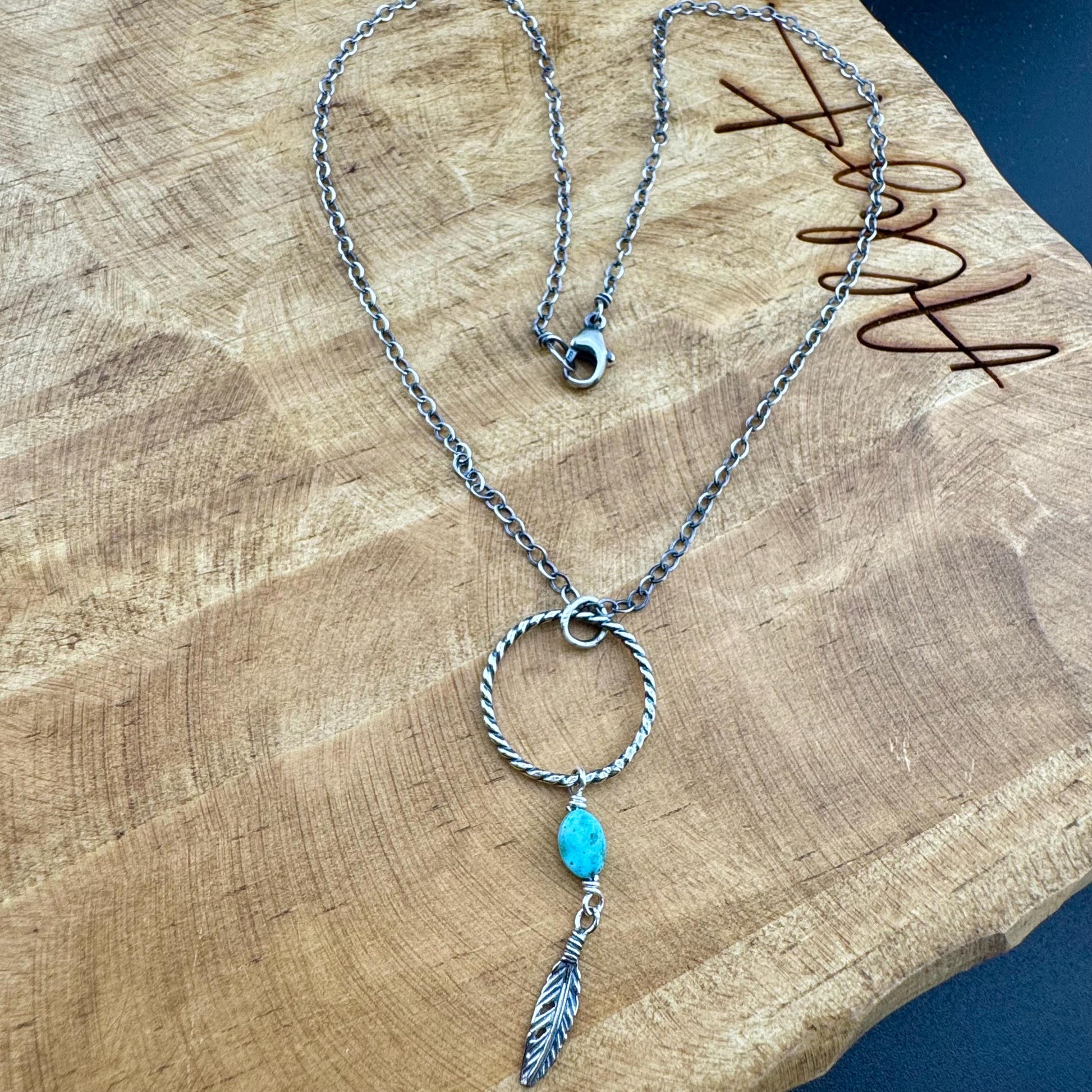 Royston Turquoise Sterling Silver Necklace: Circle Pendant with Feather Accent