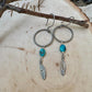 Elegant Royston Turquoise Sterling Silver Circle Earrings with Feather Accents