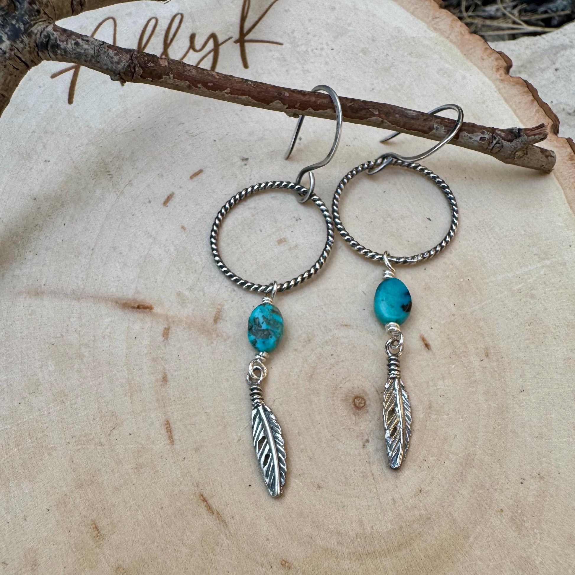 Elegant Royston Turquoise Sterling Silver Circle Earrings with Feather Accents