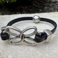 Embossed leather bracelet with stainless steel twisted butterfly connector, dark brown or black